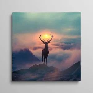 Tableau cerf majestueux silhouette au sommet d'une montagne au lever du soleil dans la brume
