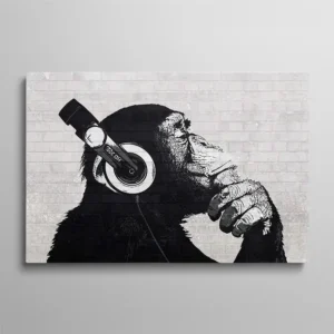 Tableau chimpanzé noir et blanc avec casque audio profil pensif sur fond brique