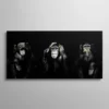 Tableau trois singes de la sagesse noir et blanc mains dorées sur fond noir
